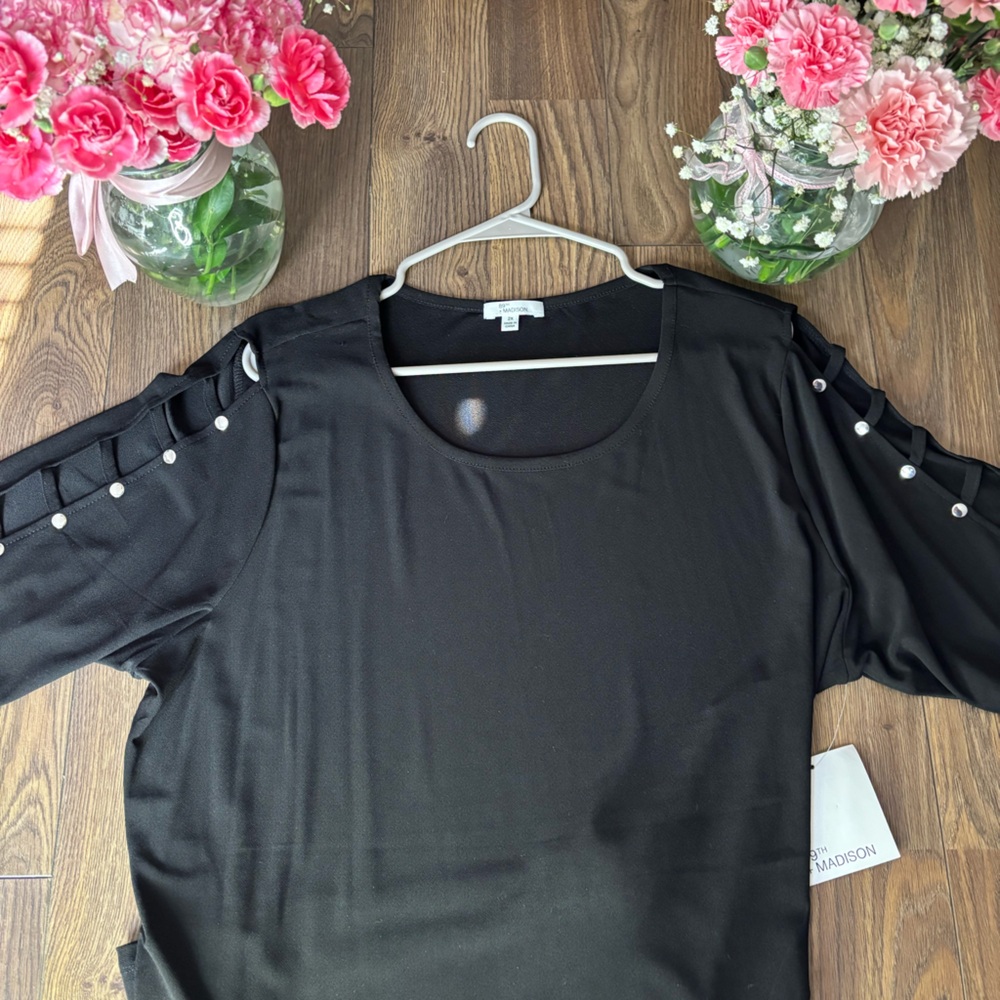 Women’s black arm cut out blouse